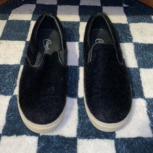 Black fuzzy slip on shoes